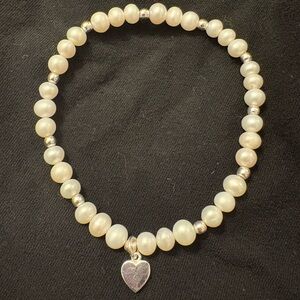Lustrous Pearl Bracelet with Heart Charm